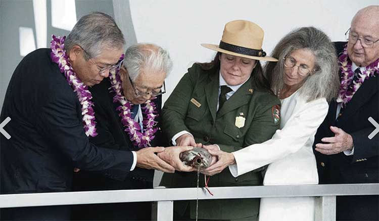 Japanese Consul General Koichi Ito, left; Dr. Hiroya Sugano, director general of the Zero Fighter Admirers Club; Jacqueline Ashwell, superintendent of the Pearl Harbor National Memorial; Elissa Lines, Pearl Harbor Aviation Museum director; and Jack DeTour, a World War II B-25 pilot, made an offering of bourbon Friday at the Blackened Canteen Ceremony